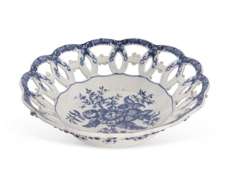 A fine Worcester porcelain basket circa 1770, printed with the pine cone pattern within painted fret borders, 26cm diameter