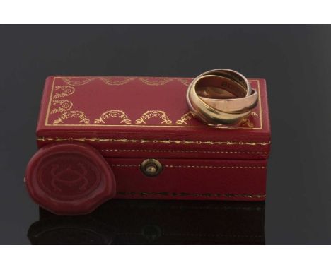 An 18ct Cartier trinity ring, the white, yellow and rose gold bands hallmarked London 1973, stamped Cartier, size J, 14.7g, i