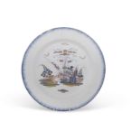 An 18th Century Delft charger with polychrome design, probably Bristol, 33cm diameter