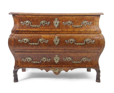 A French Louis XVI walnut veneered Bombe commode chest with three pine lined drawers fitted with elaborate brass handles and 