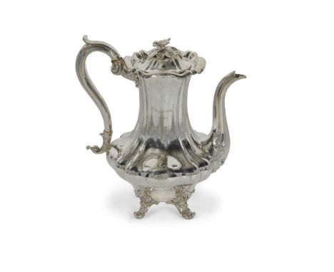 A Victorian silver coffee pot of lobed baluster form, the domed hinge lid with a cast floral finial, swan neck spout and scro