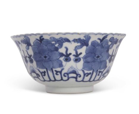 A Chinese porcelain bowl of ribbed form with everted rim decorated with flowers within stylised border, four charcter Kangxi 