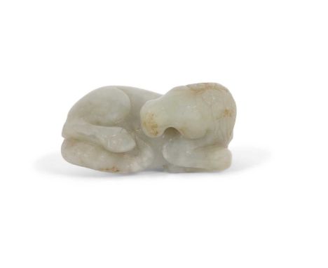 A jade carving of a horse with some brown occlusions, 6cm long