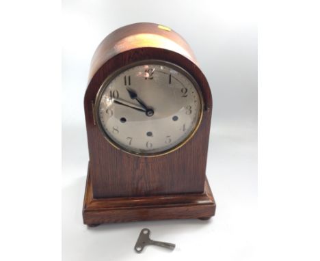 An oak mantel clock with Westminster chime 