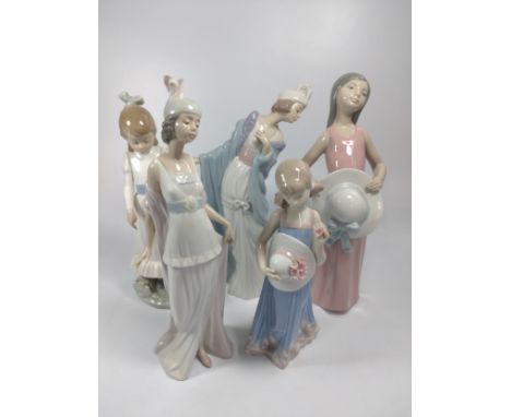 Four Lladro figures of girls and young ladies, 20cm to 26cm (one finger chipped), and Nao girl with puppy, 24cm (one thumb ch