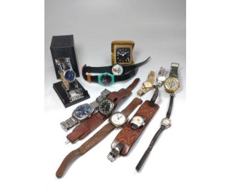 A collection of eleven watches and a travel clock. Watches including a tissot Automatic Seastar (1970's) on original bracelet