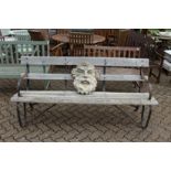 A good wrought iron and wooden garden bench