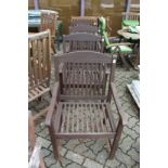 A good set of four wooden garden armchairs