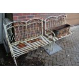 A pair of wrought iron benches
