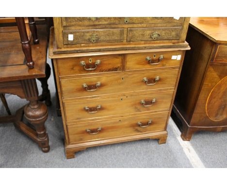 A small George III mahogany chest of two short and three graduated long drawers on bracket feet