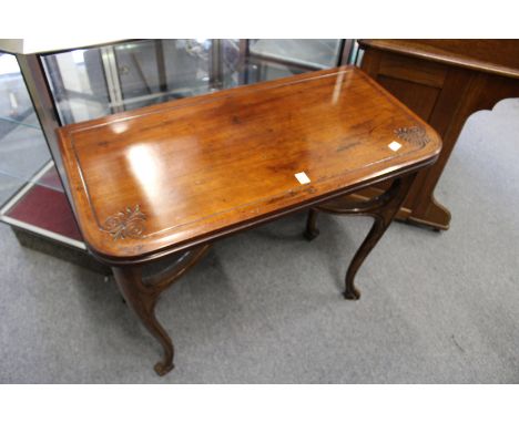 A Victorian walnut foldover card table