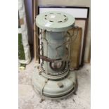 An old paraffin floor standing heater