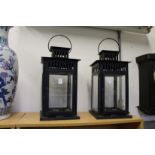 A pair of large candle lanterns