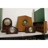 Various clocks and a cutlery tray