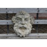 A reconstituted stone wall planter/fountain modelled as a mans head