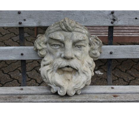 A reconstituted stone wall planter/fountain modelled as a mans head