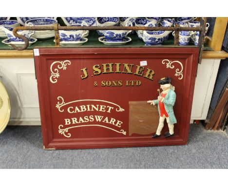 An old shop sign with wrought iron bracket