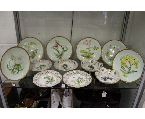 A set of six Meissen floral decorated small plates with pierced borders together with a pair of matching small dishes (one af