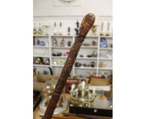 A Chinese carved bamboo walking stick