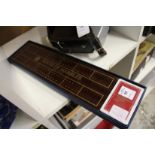 A cribbage board and cards