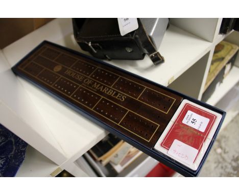 A cribbage board and cards