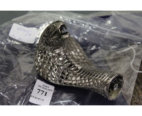 A cobras head walking stick handle