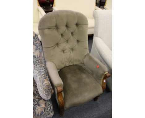 A Victorian button upholstered armchair