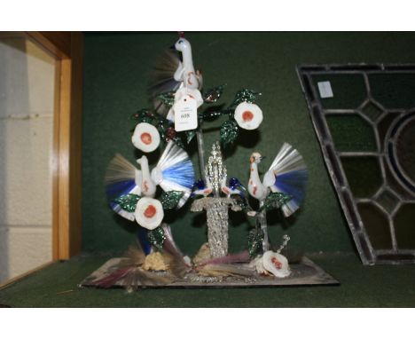 An unusual glass ornamental item depicting exotic birds