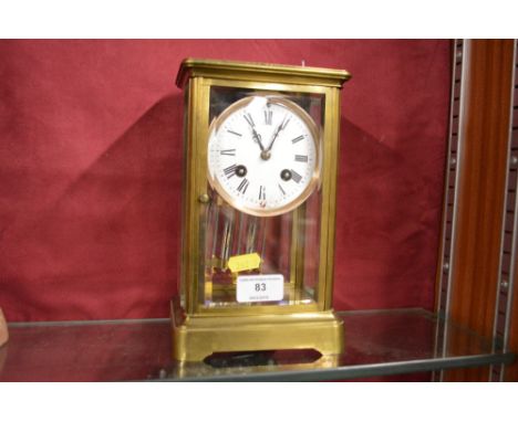A 19th Century French brass cased four glass mantel clock 