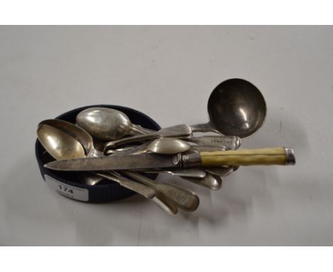 A quantity of various silver tea and coffee spoons, a silver ladle ,and a silver bladed knife 