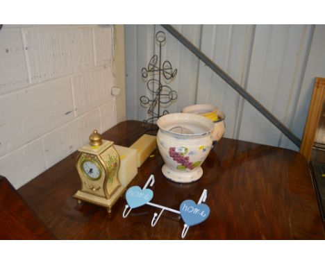 Three pottery jardinieres together with a metal wine rack, two candles, a set of hooks, and a floral painted clock