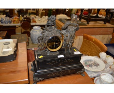 A black slate and spelter figural mounted clock (key and pendulum on rostrum)