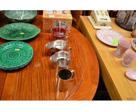 Two silver plated sauce boats; two tankards; a stainless steel tea set etc