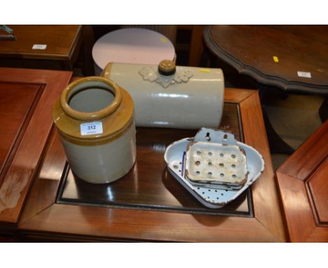 A stoneware flagon; a hot water bottle and a small quantity of enamel soap dishes