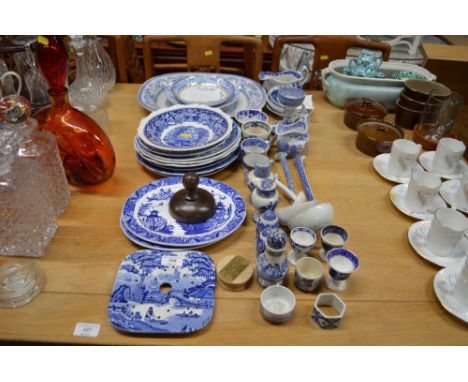 A quantity of various blue and white china to include plates; mugs; a candle stick etc