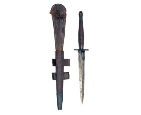 A FAIRBURN-SYKES MODEL 'B2' DAGGER, circa 1943-44, with blacked 6 5/8in. blade (finish lost through use), blued oval iron cro