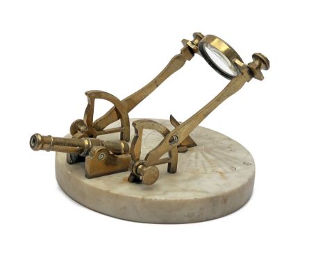 A RARE SUNDIAL WITH MIDDAY SIGNAL CANNON, early 19th century and probably French, with circular marble base with brass gnomon