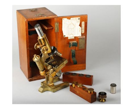 A Ross lacquered brass Compound Monocular Microscope, with graduated eyepiece tube, micrometer fine focusing, mechanical stag