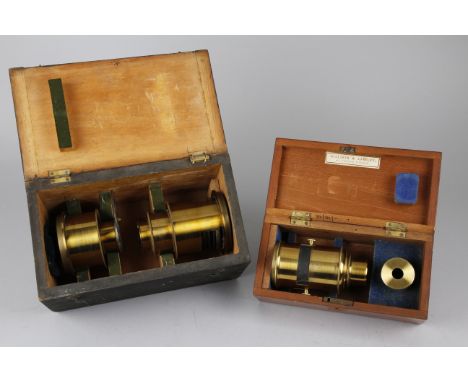 Three Brass Bound Lenses for a Magic Lantern in Two Fitted  Boxes, one box, 270mm wide, containing two lenses, with one being