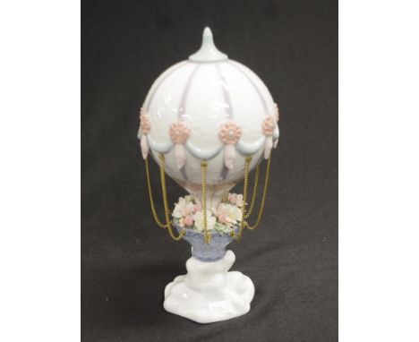 Lladro 'Flying High' hot air balloon ceramic piece model of a passenger hot air balloon, with brass chains to suspended bloss