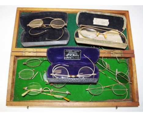 Collection vintage pince-nez spectacles including: a group of 7 metal framed spectacles, all included in a wood storage box; 