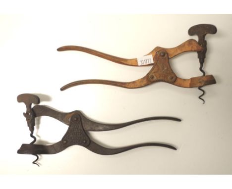 Two antique Lund single lever corkscrews 21cm wide approx