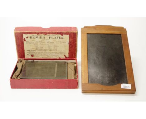 Early advertising glass slide together with a box of blank slides and a Primo camera part
