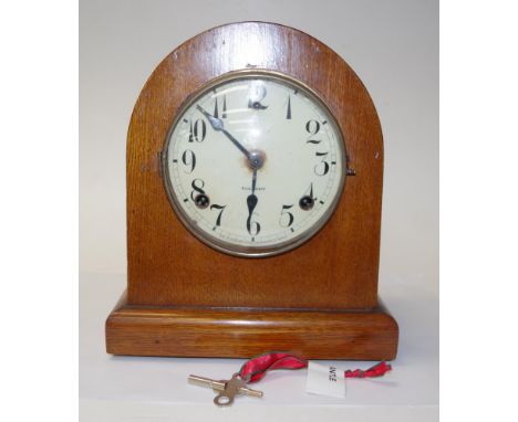 Gilbert 8 day oak cased mantle clock striking on a gong. 27cm high.
