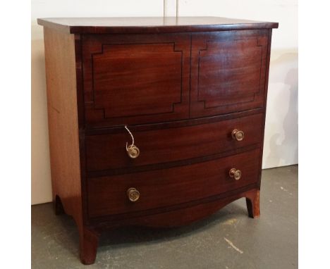 An early 19th century mahogany and ebony inlaid bow front commode cabinet, on splay bracket feet, height 70cm, width 69cm, de