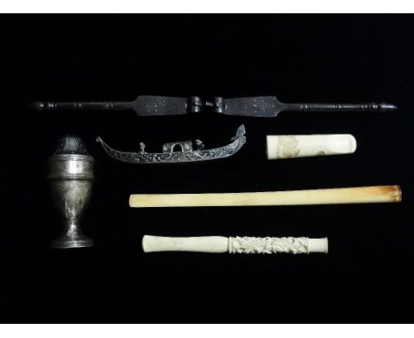 Three late 19th century ivory cigarette holders, one Japanese carved with a tiger, together with a nutcracker, a Venetian min