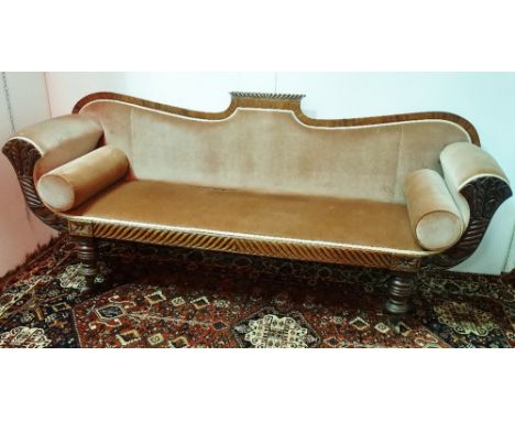 A William IV mahogany scroll arm sofa, the gadrooned and palm leaf carved frame raised on turned legs with brass castors, max