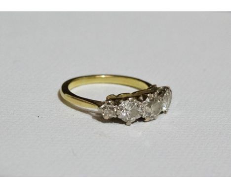 A high carat yellow gold ring set five graduated diamonds, measuring a total of 1.2ct approximately, size L.