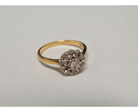 An 18ct diamond illusion set ring, size O.