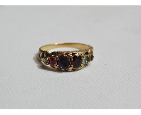 A high carat gold Regard ring set various gemstones, size M.